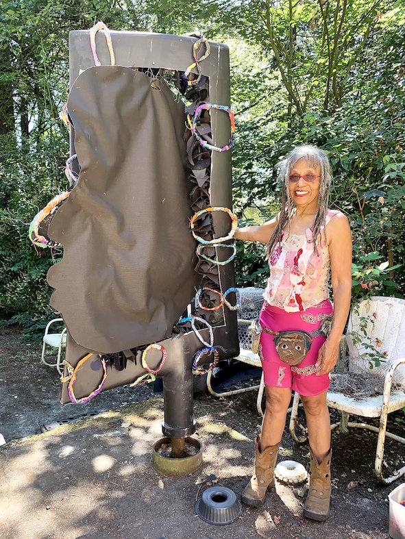 Marita Dingus with her nuclear sculpture