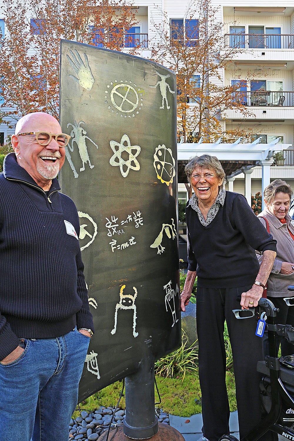 Artist Tom Gormally and Doris Garvey with his nuclear sculpture of Gerry Garvey
